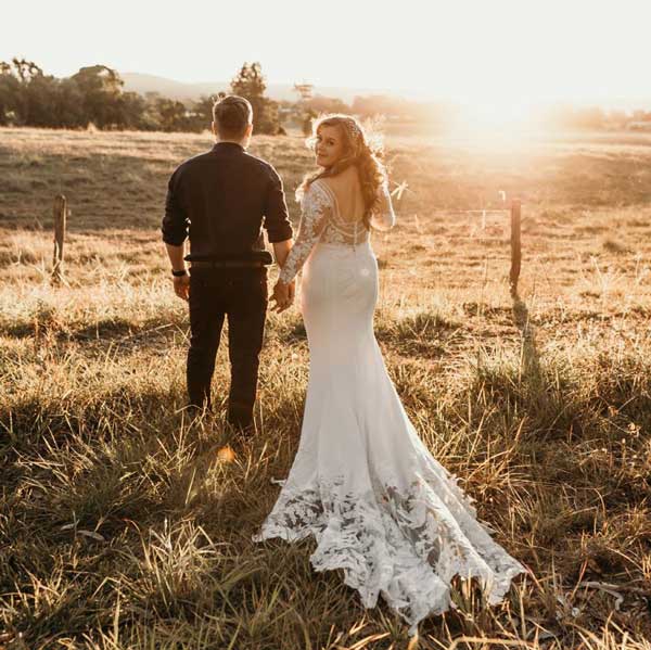 Bride in a stunning backless wedding gown