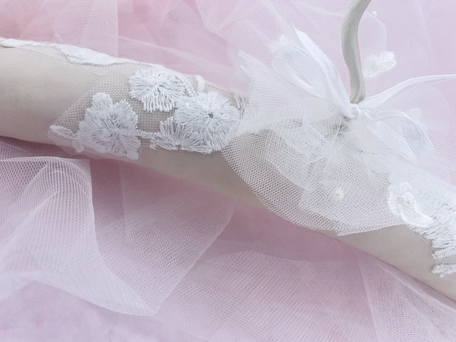 white embossed salmon coloured wedding dress hanger